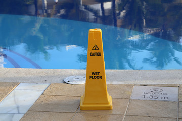 Caution / Yellow column near the pool, warns of danger