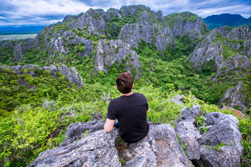 Tourists climb the natural view (Khao Daeng viewpoint) 360 degree natural scenery located in Prachuap Khiri Khan, Thailand.