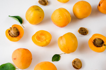Many apricots on the white background. Top view
