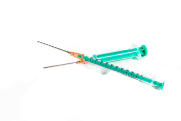 Two small syringes isolated in white background