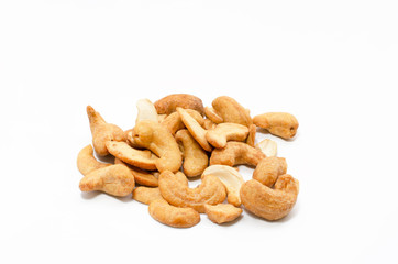 Salt roasted cashew nuts isolated on white background.