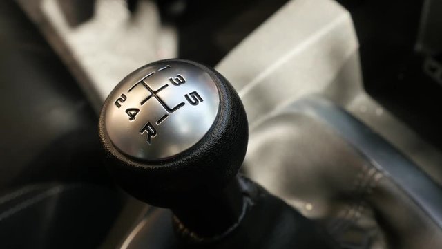 Touching manual gear shift stick in car 4K video
