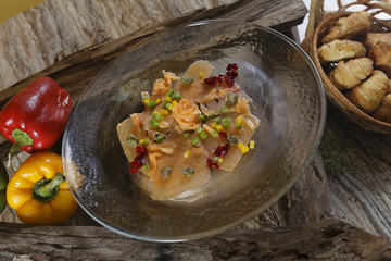 Carpaccio of fresh salmon with pieces of pepper, capers and olive oil. The dish, based on the Piedmont specialty raw meat all'albese, was invented in 1950 by Giuseppe Cipriani.
