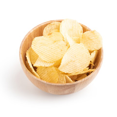 Potato chips in wooden bowl on a white background.