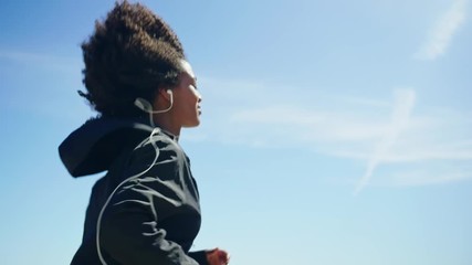 Beautiful young happy black girl excercising outdoors - Powered by Adobe