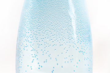 many small air bubbles on the bottle