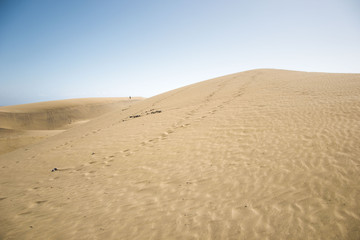 minimalistic view of sand dunes landscape, minimalism in nature, sand everywhere and windy weather, shapes and creations