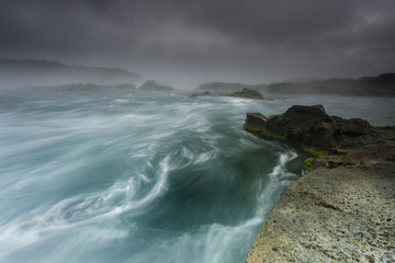Rocky beach coastal scene / Awesome ocean waves and landscape in south Iceland