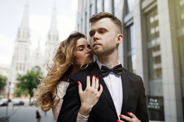 Bride and groom posing on the streets of the old city.