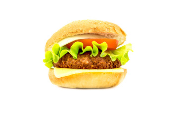 Big fat hamburger with fresh vegetables isolated on a white background. Bright view photo. 