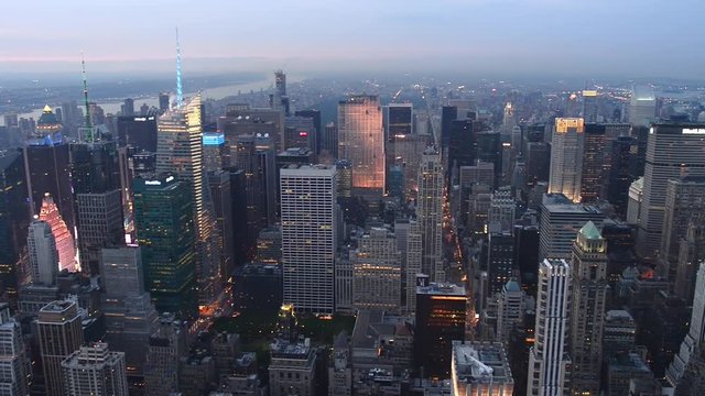 NEW YORK CITY - JUNE 2013: Aerial view of city skyline at sunset. The city attracts 50 million tourists every year