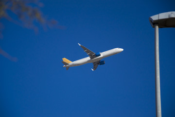 take off, cruising or landing of some airline aircraift in air, nearby airport, huge and safe option of transport, safest traveling