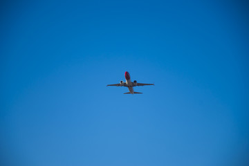 take off, cruising or landing of some airline aircraift in air, nearby airport, huge and safe option of transport, safest traveling