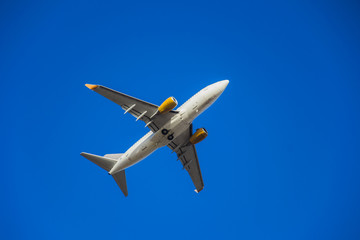 take off, cruising or landing of some airline aircraift in air, nearby airport, huge and safe option of transport, safest traveling