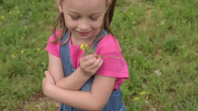 5-year-old girl with a flower