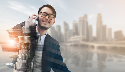 Double exposure businessman using mobile phone.