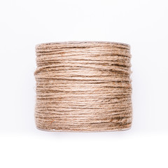 A bundle of brown hemp rope isolated on white background.