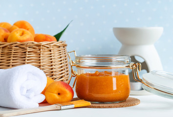 Homemade apricot face mask in a glass jar. DIY cosmetics and spa. Copy space. 