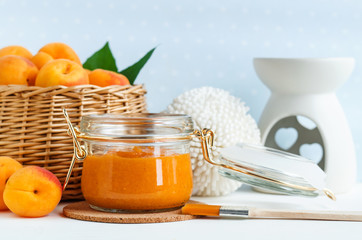 Homemade apricot face mask in a glass jar. DIY cosmetics and spa. Copy space. 