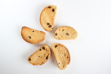 hardtack biscuits with raisins on white background