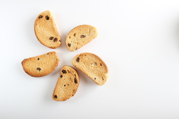 hardtack biscuits with raisins on white background