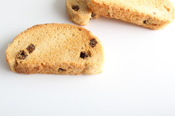 hardtack biscuits with raisins on white background