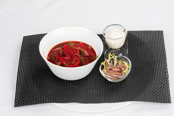 Classic borsch with dill, sour cream and pieces of meat.