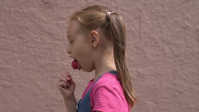 5-year-old girl with a lollipop