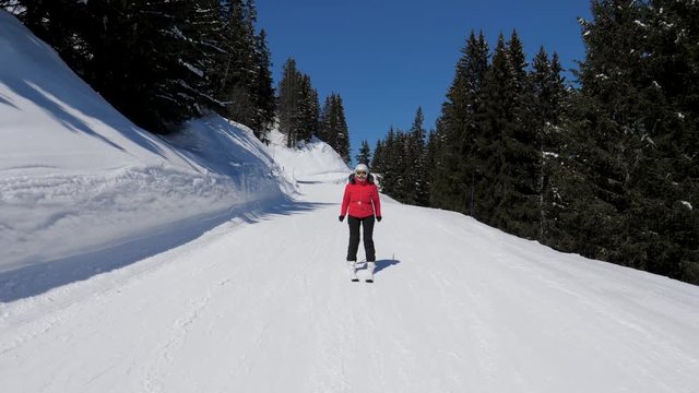 Active Mature Skier Ski Down The Mountain Slope In Winter Fairy Tale