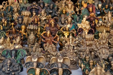 Fototapeta premium Small bronze statuettes on the street market in Rishikesh.