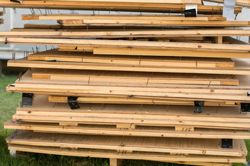 Stacked up wooden cargo pallets .Wood pallet in factory warehouse.