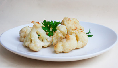 Cauliflower fried in flour and with parsley leaves. Candid.