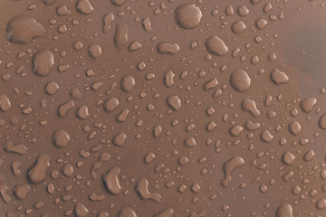 Grey water droplet on the roof of car