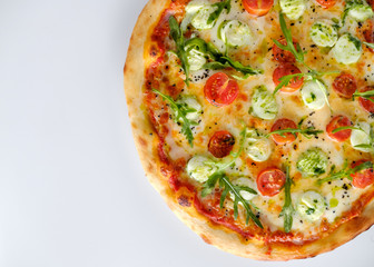 Pizza with tomatoes and arugula and mozzarella