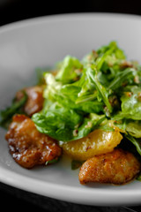  salad with chicken steak, salad mix, orange, cheese. Under the olive oil.