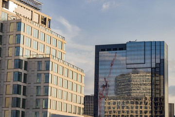 Glass tall city skyscrapers with reflections in the glass