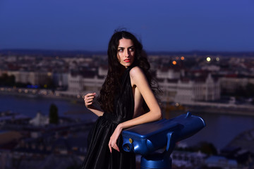 Modern life with princess in celebrity style. Luxury woman in evening dress with view on city. Girl...
