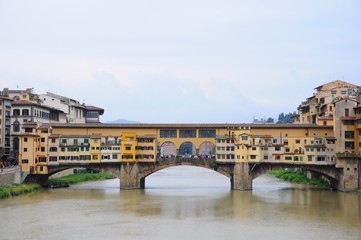 Obraz premium Ponte Vecchio known as Old Bridge - Famous medieval stone arch bridge over the Arno River, in Florence, Italy