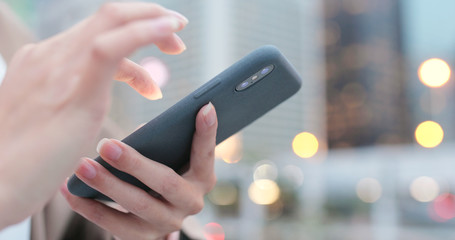 Woman use of smart phone at night