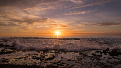 Powerful wave and sunrise at Newcastle beach Australia
