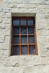 close up of a wooden window  on white wall