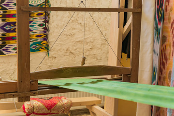 close up of arabic loom for weaving carpet in the room