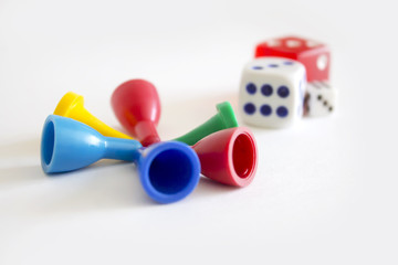 Dice and colored chips for Board games on white background isolated