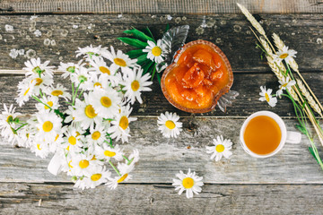 Cup of tea,  flowers, on dark wooden background