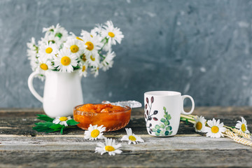 Cup of tea,  flowers, on dark wooden background