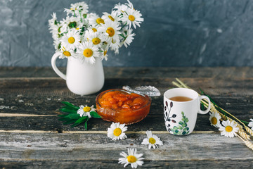 Cup of tea,  flowers, on dark wooden background
