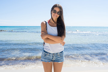 Happy woman smiling on the beach