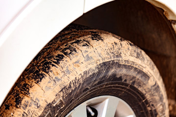 Closeup shot of car wheel covered by clay