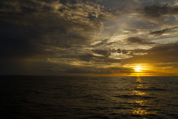 Beautiful ocean view with a dramatic sky cloud golden sunset  