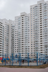 Fototapeta premium Inner courtyard of grey multi-storey residential house.